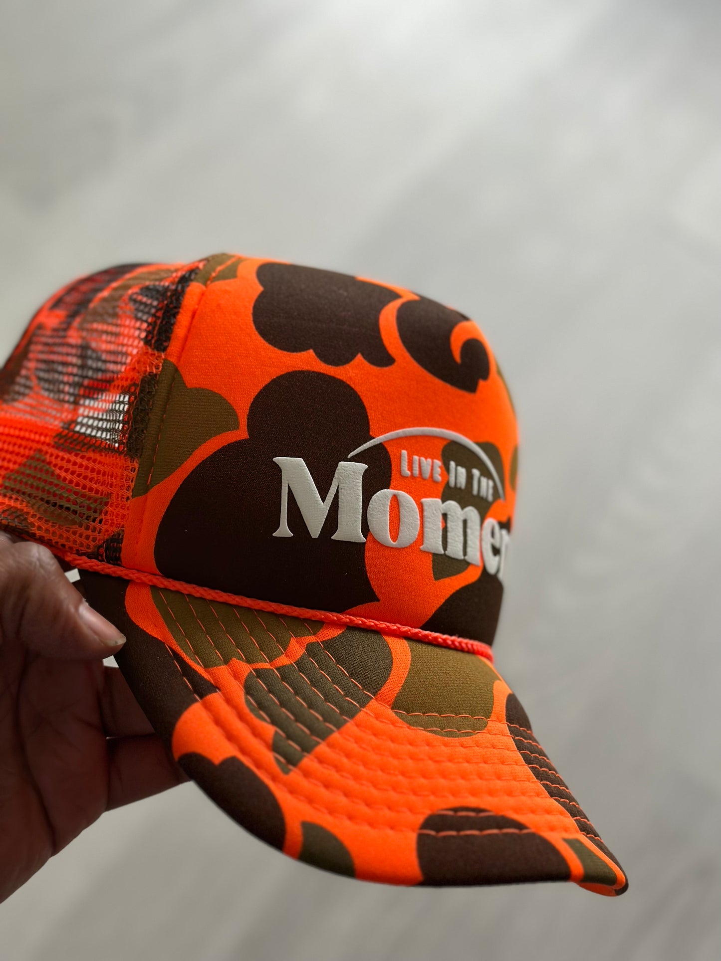 Live In The Moment (Orange camo) Trucker